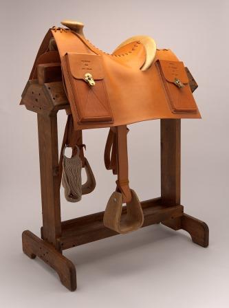 Rare replica of a Pony Express mochila, a leather panel slung over the saddle which held the mail. The mochila was transferred from one saddle to another during the swift changes in horses.